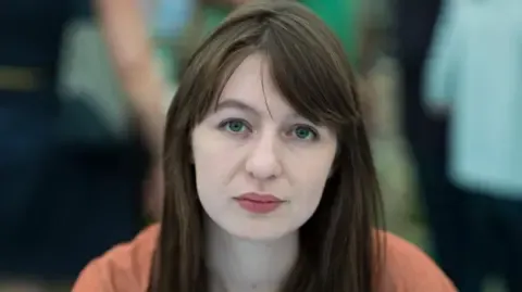 Irish author Sally Rooney states she cannot travel to the UK because of potential arrest